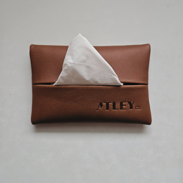 Brown leather tissue holder travel pouch with tissues